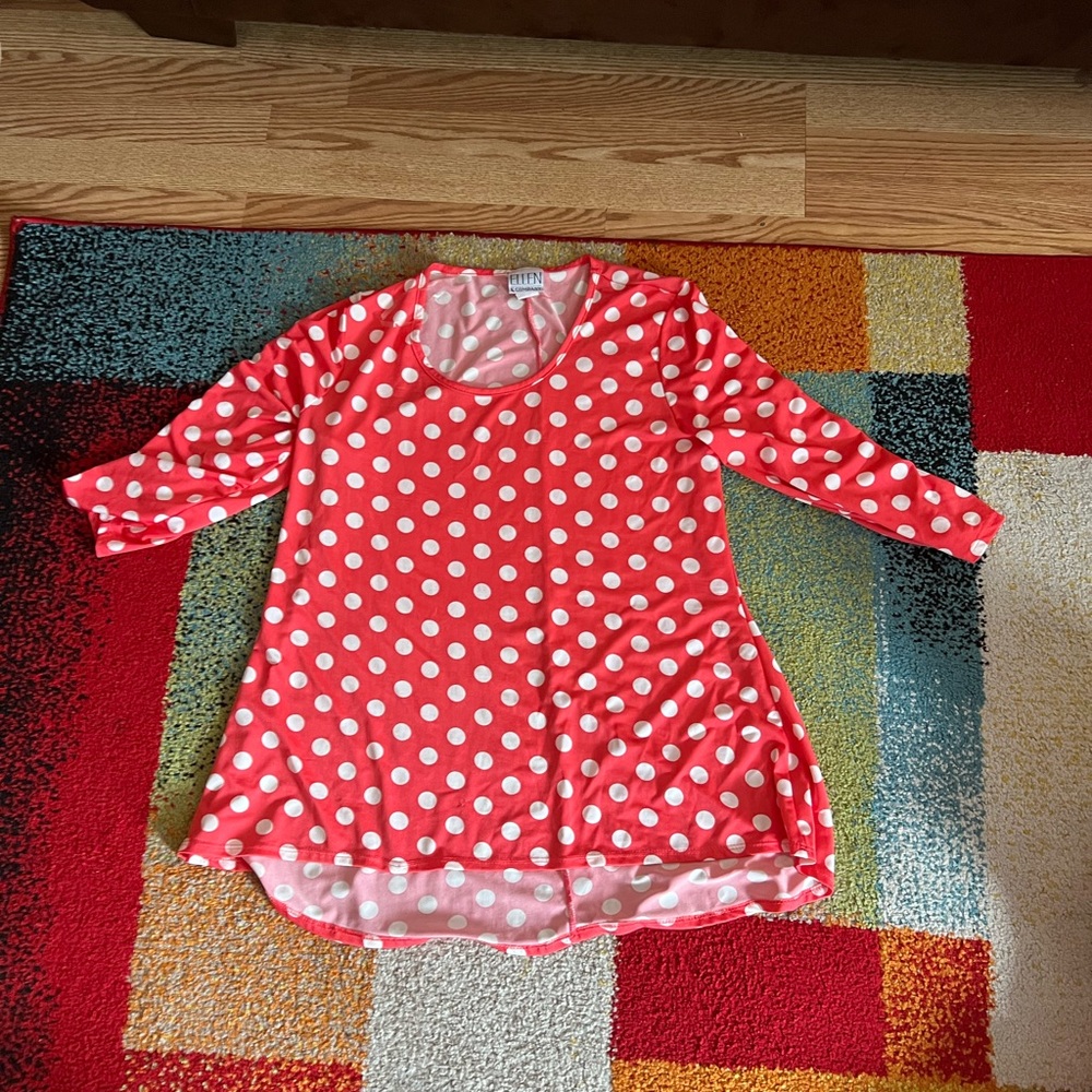 Pink shirt with white polkadots